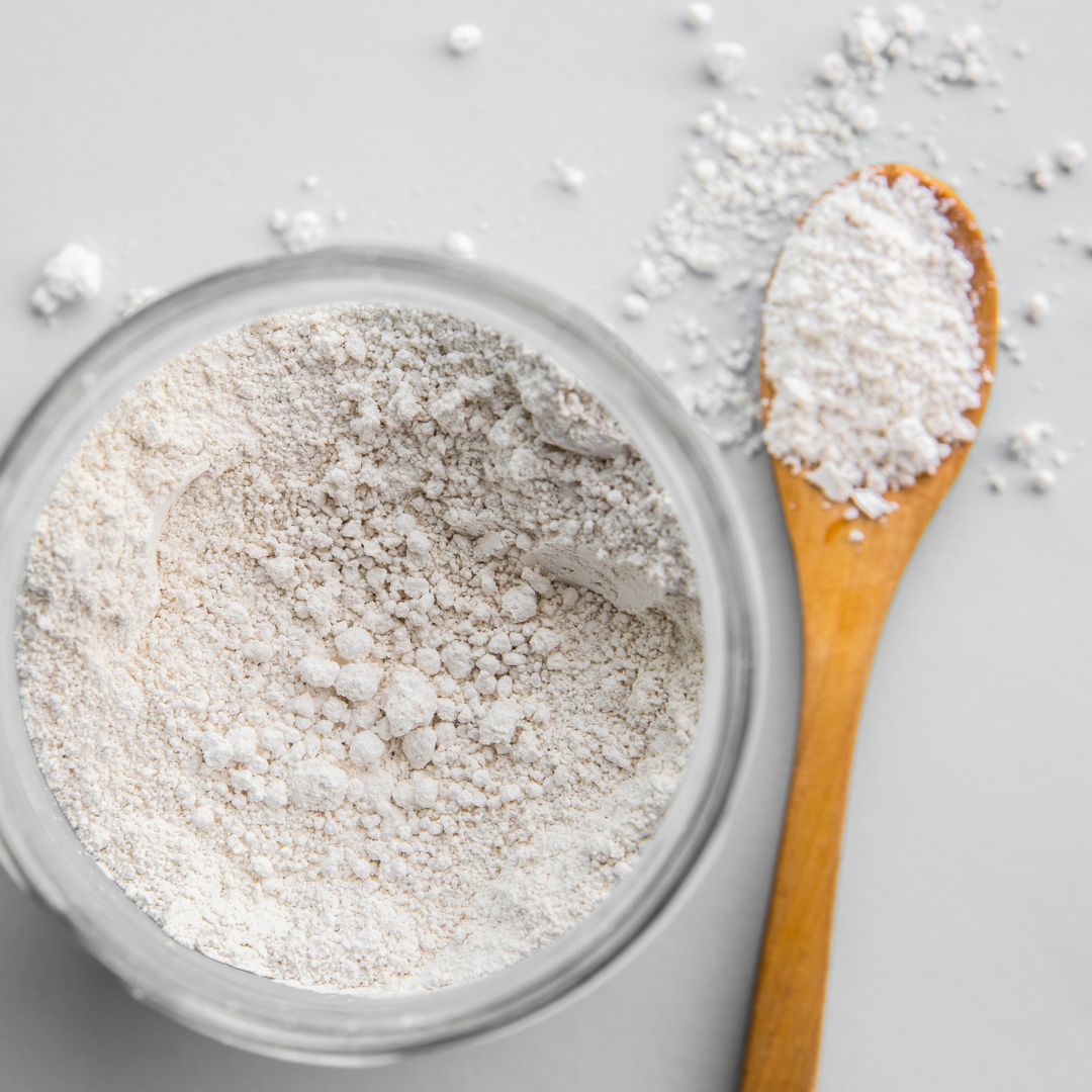 Bowl of Diatomaceous Earth powder and spoon